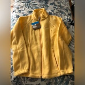 Brand new soft yellow zip up jacket with zippered pockets